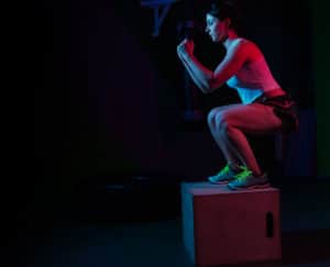 female working out on a box