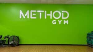Method Gym White Text on Green Wall
